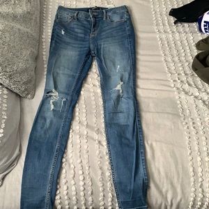 Light blue skinny jeans with rips